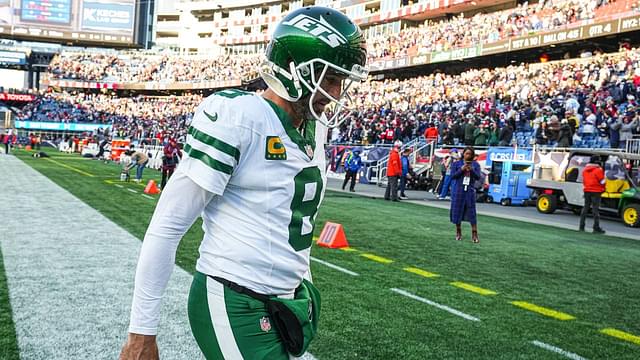 New York Jets quarterback Aaron Rodgers (8) exits the field after being defeated by the New England Patriots in the second half at Gillette Stadium.