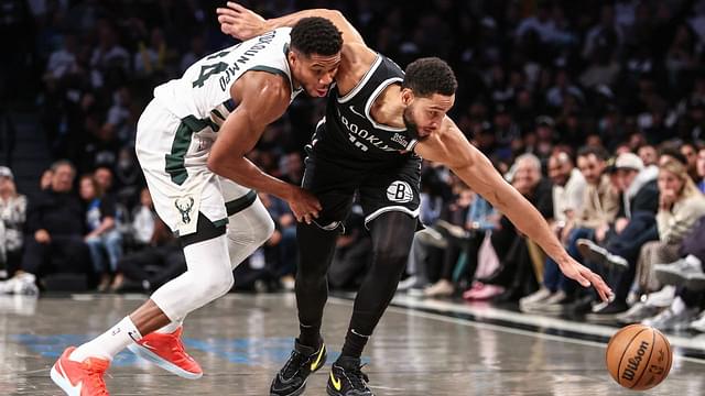 Milwaukee Bucks forward Giannis Antetokounmpo (34) and Brooklyn Nets guard Ben Simmons (10) fight for a loose ball in the fourth quarter at Barclays Center.