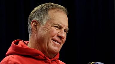 Bill Belichick smiles during questions at a press conference.