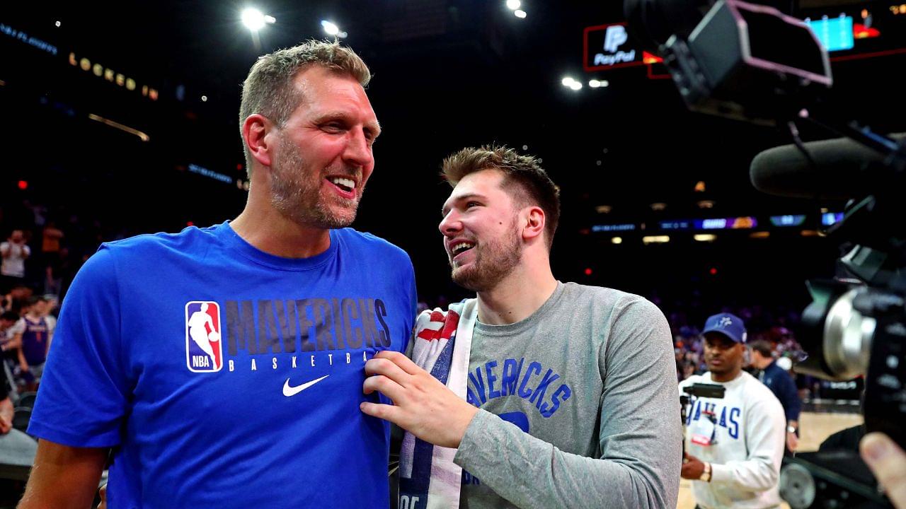 Dallas Mavericks guard Luka Doncic (77) greets former player Dirk Nowitzki after beating the Phoenix Suns in game seven of the second round for the 2022 NBA playoffs at Footprint Center.