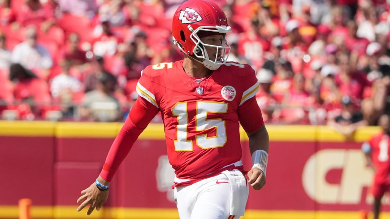 Aug 17, 2024; Kansas City, Missouri, USA; Kansas City Chiefs quarterback Patrick Mahomes (15) throws a behind-the-back underhand pass to tight end Travis Kelce (87) (not pictured) against the Detroit Lions during the first half at GEHA Field at Arrowhead Stadium.