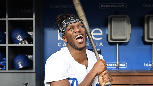 British YouTuber KSI and cruiserweight professional boxer swings a bat in the dugout prior to the game between the Los Angeles Dodgers and the Arizona Diamondbacks at Dodger Stadium