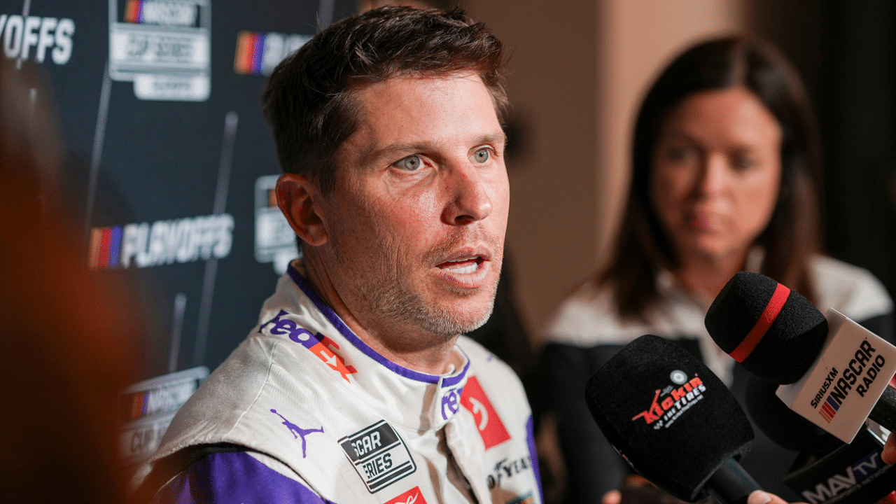 Denny Hamlin speaks to media members during the NASCAR Playoffs Media Day at the Charlotte Convention Center.