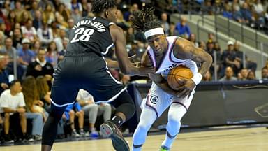 Brooklyn Nets forward Dorian Finney-Smith (28) guards Los Angeles Clippers guard Terance Mann (14) as he drives to the basket in the first half at Frontwave Arena.