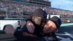 Michael Jordan hugging Tyler Reddick after winning the Homestead Miami Race.