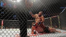 Jake Collier (red gloves) fights Chris Barnett (blue gloves) during UFC 279 at T-Mobile Arena.