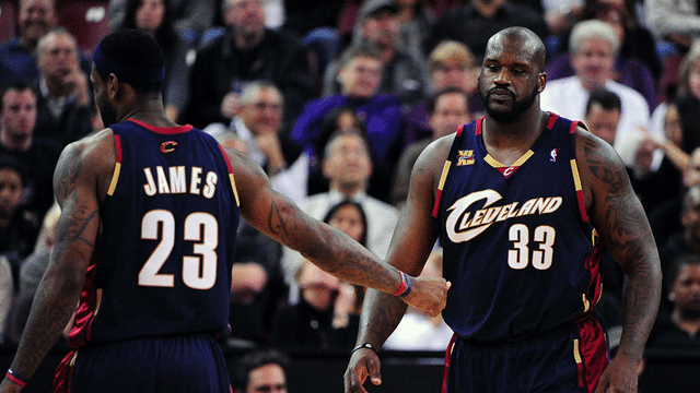 Cleveland Cavaliers center Shaquille O'Neal (33) receives a hand shake from forward LeBron James (23) after receiving his third foul during the second quarter against the Sacramento Kings at Arco Arena.