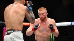 Bo Nickal (red gloves) fights Cody Brundage (blue gloves) during UFC 300 at T-Mobile Arena.