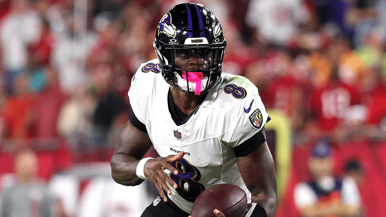 Baltimore Ravens quarterback Lamar Jackson (8) runs with the ball against the Tampa Bay Buccaneers during the second half at Raymond James Stadium.