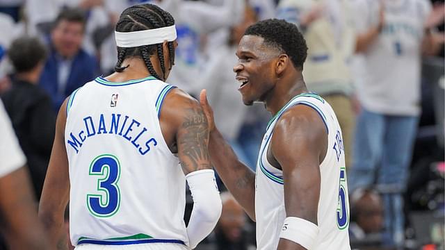 Minnesota Timberwolves guard Anthony Edwards (5) and forward Jaden McDaniels (3) talk in the third quarter against the Denver Nuggets during game six of the second round for the 2024 NBA playoffs at Target Center.