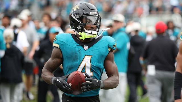 Jacksonville Jaguars running back Tank Bigsby (4) takes the ball to the sidelines after his touchdown in the game between the Indianapolis Colts and Jacksonville Jaguars