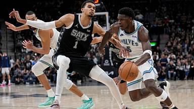 Minnesota Timberwolves guard Anthony Edwards (5) drives to the basket against San Antonio Spurs forward Victor Wembanyama (1) during the second half at Frost Bank Center.