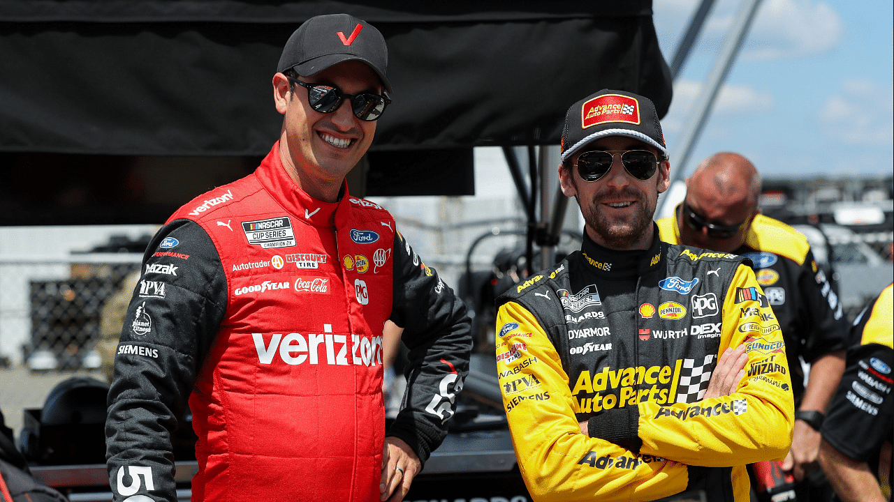 NASCAR Cup Series driver Joey Logano (left) and driver Ryan Blaney chat during practice and qualifying for the HighPoint.com 400 at Pocono Raceway.