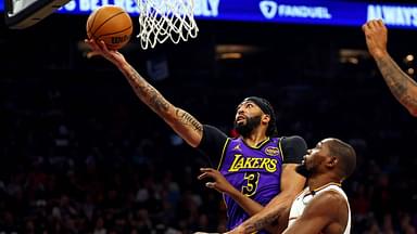 Los Angeles Lakers forward Anthony Davis (3) shoots the ball against Phoenix Suns forward Kevin Durant (35) during the first quarter at Footprint Center