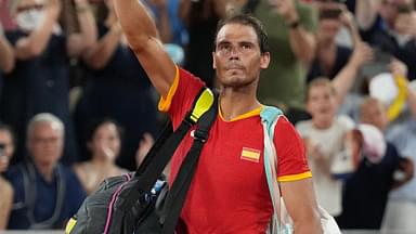 Rafael Nadal (ESP) waves to the crowd after losing to Austin Krajicek and Rajeev Ram (USA) in a men's doubles quarterfinal tennis match during the Paris 2024 Olympic Summer Games at Stade Roland Garros