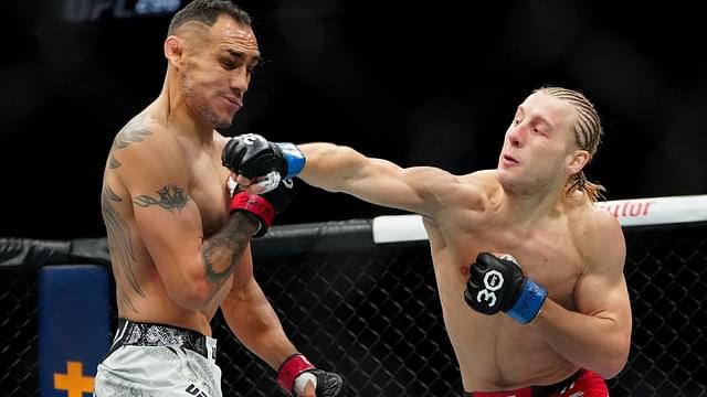 Tony Ferguson (red gloves) fights Paddy Pimblett (blue gloves) during UFC 296 at T-Mobile Arena. Mandatory