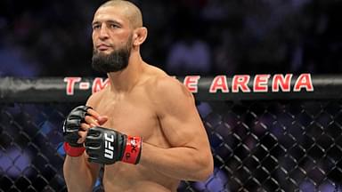 Khamzat Chimaev (red gloves) fights Kevin Holland (blue gloves) during UFC 279 at T-Mobile Arena.