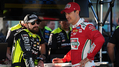 NASCAR Cup Series driver Ryan Blaney (L) talks with NASCAR Cup Series driver Joey Logano (R) during practice for the Straight Talk Wireless 400 at Homestead-Miami Speedway.