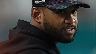 Miami Dolphins quarterback Tua Tagovailoa stands on the sidelines during the second half against the Tennessee Titans at Hard Rock Stadium.