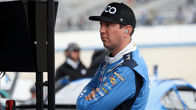 NASCAR Cup Series driver Kyle Busch looks at a computer on pit road during practice and qualifying for the Wurth 400 at Dover Motor Speedway.