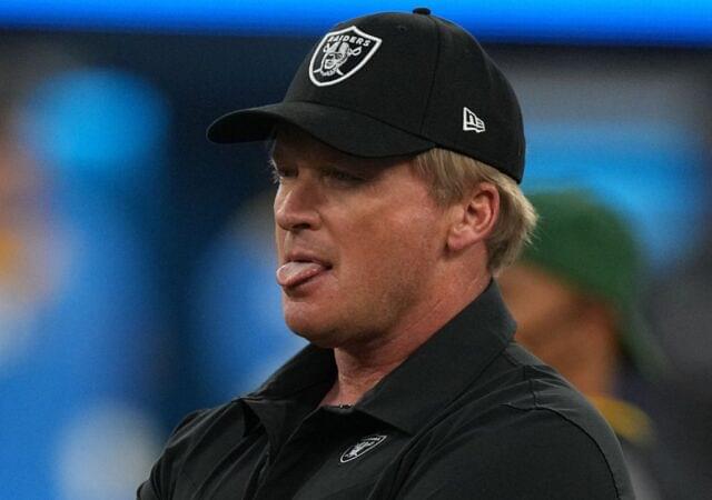 Las Vegas Raiders head coach Jon Gruden looks on as his players warm up before a game against the Los Angeles Chargers at SoFi Stadium.