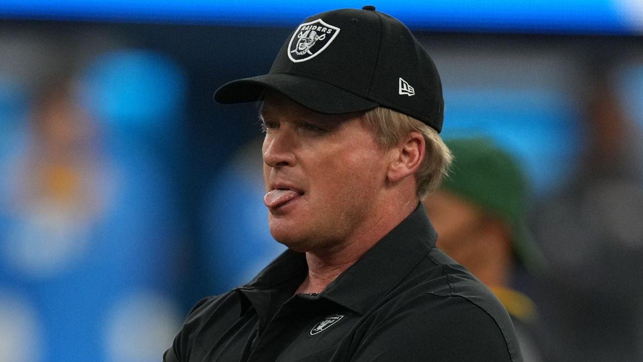 Las Vegas Raiders head coach Jon Gruden looks on as his players warm up before a game against the Los Angeles Chargers at SoFi Stadium.