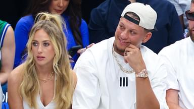 Kansas City Chiefs quarterback Patrick Mahomes II sits with his wife Brittany and tight end Travis Kelce during the game between the Dallas Mavericks and Minnesota Timberwolves during game three of the western conference finals for the 2024 NBA playoffs at American Airlines Center.