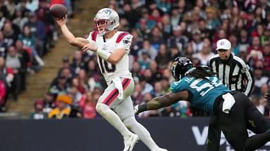 New England Patriots quarterback Drake Maye (10) throws the ball against Jacksonville Jaguars defensive tackle DaVon Hamilton (52) in the first half of an NFL International Series game at Wembley Stadium.