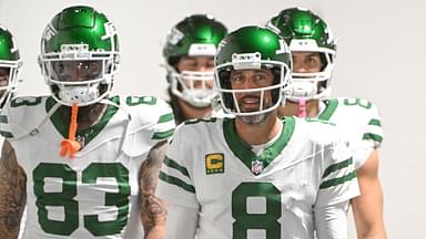 New York Jets quarterback Aaron Rodgers (8) walks onto the field for a game against the Pittsburgh Steelers at Acrisure Stadium.