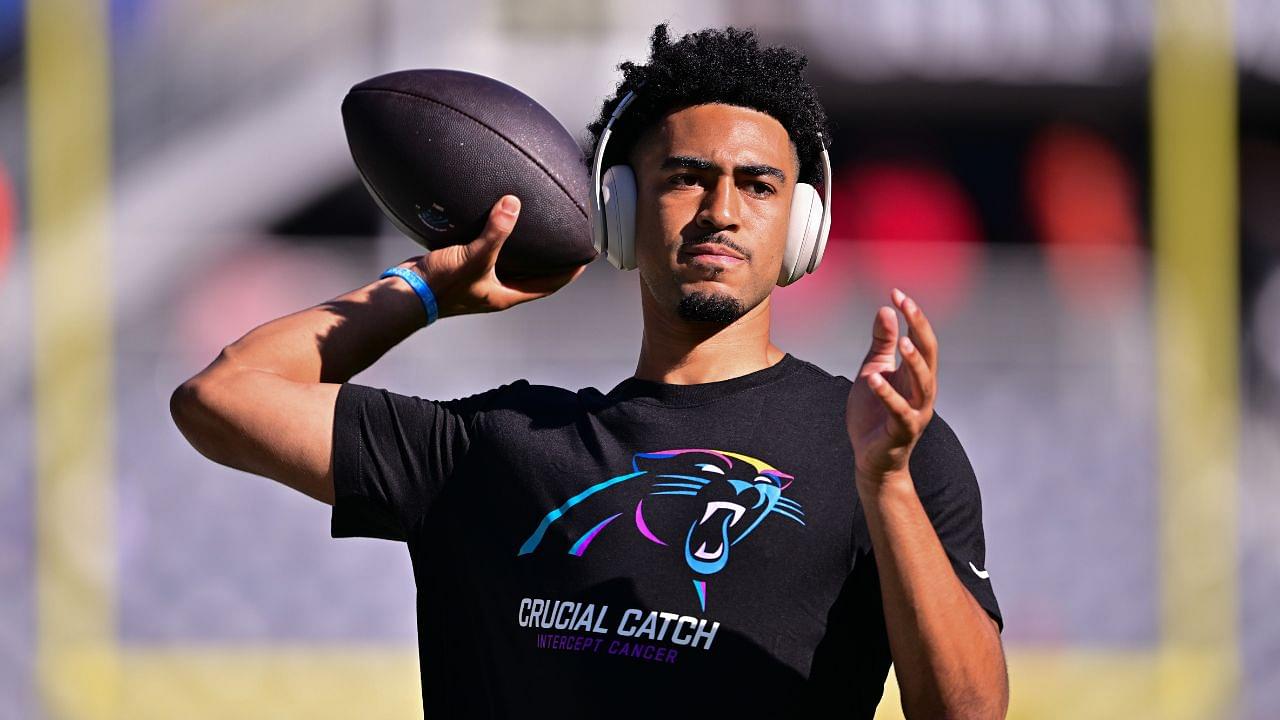 Carolina Panthers quarterback Bryce Young (9) warms up before the game against the Chicago Bears at Soldier Field.