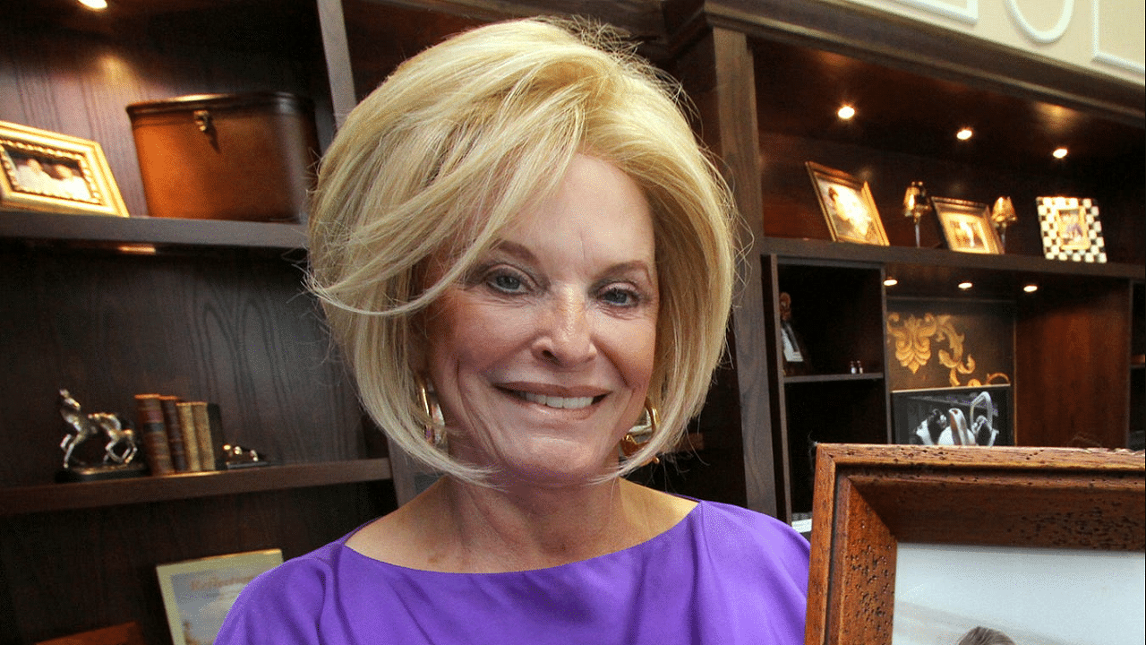 Betty Jane France holds her favorite photograph of her late husband Bill France Jr., on Wednesday May 15, 2013 in her office.