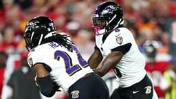 Oct 21, 2024; Tampa, Florida, USA; Baltimore Ravens quarterback Lamar Jackson (8) hands off to running back Derrick Henry (22) against the Tampa Bay Buccaneers in the first quarter at Raymond James Stadium.