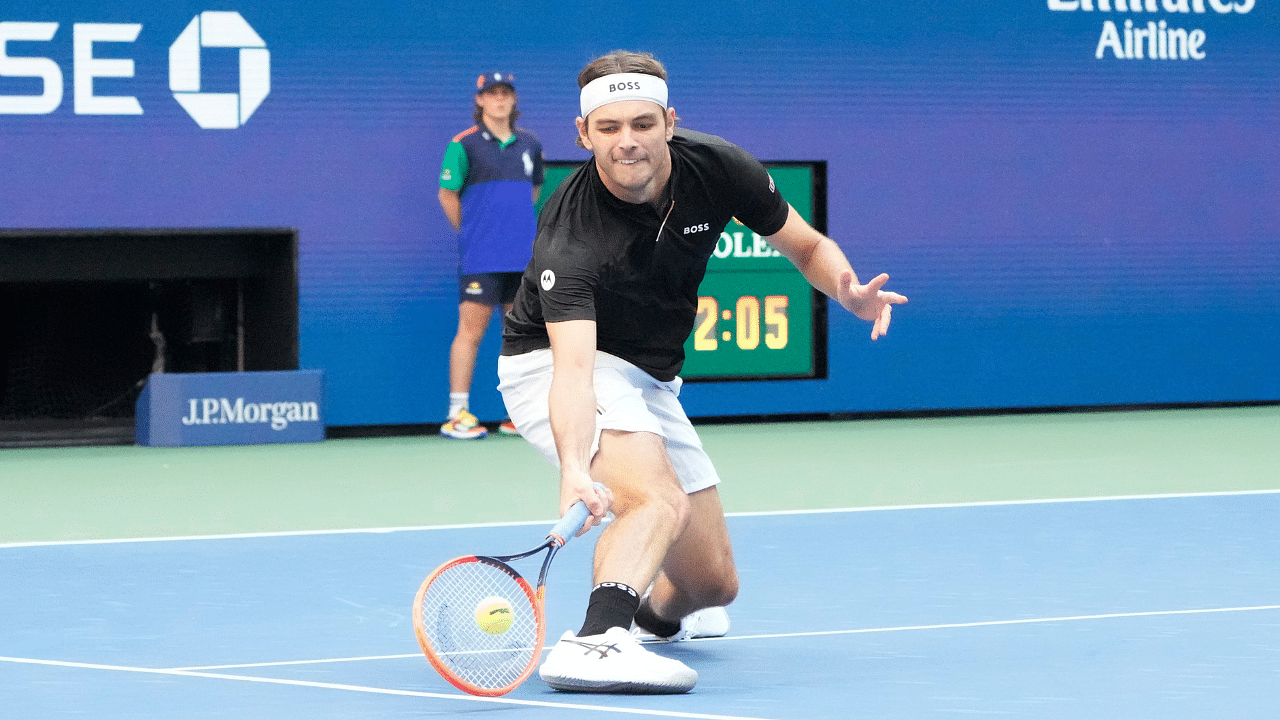 Taylor Fritz returns a shot during the men's singles final of the 2024 U.S. Open tennis tournament at USTA Billie Jean King National Tennis Center