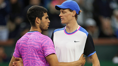 Carlos Alcaraz and Jannik Sinner meet at the net after their semifinal match at the BNP Paribas Open in Indian Wells