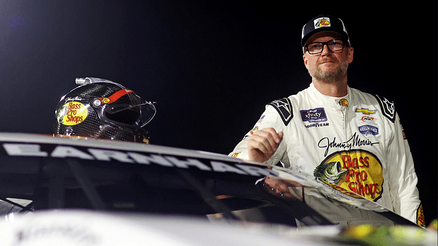 Dale Earnhardt Jr. waits next to his during qualifying for the 16th Annual Hampton Heat at Langley Speedway. Mandatory Credit: Peter Casey-Imagn Images Jul 20, 2024; Hampton, VA, USA; Dale Earnhardt Jr. waits next to his during qualifying for the 16th Annual Hampton Heat at Langley Speedway.