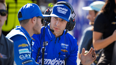 Crew chief Cliff Daniels (right) talks with NASCAR Cup Series driver Kyle Larson during qualifying for the NASCAR Championship Race at Phoenix Raceway.