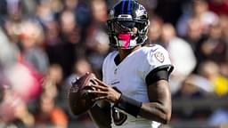 Oct 27, 2024; Cleveland, Ohio, USA; Baltimore Ravens quarterback Lamar Jackson (8) looks for a receiver downfield against the Cleveland Browns during the second quarter at Huntington Bank Field.