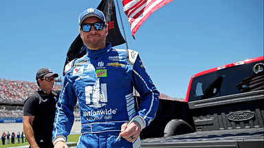 NASCAR Cup Series driver Dale Earnhardt Jr. (88) get out of a truck on the grid before the GEICO 500 at Talladega Superspeedway.