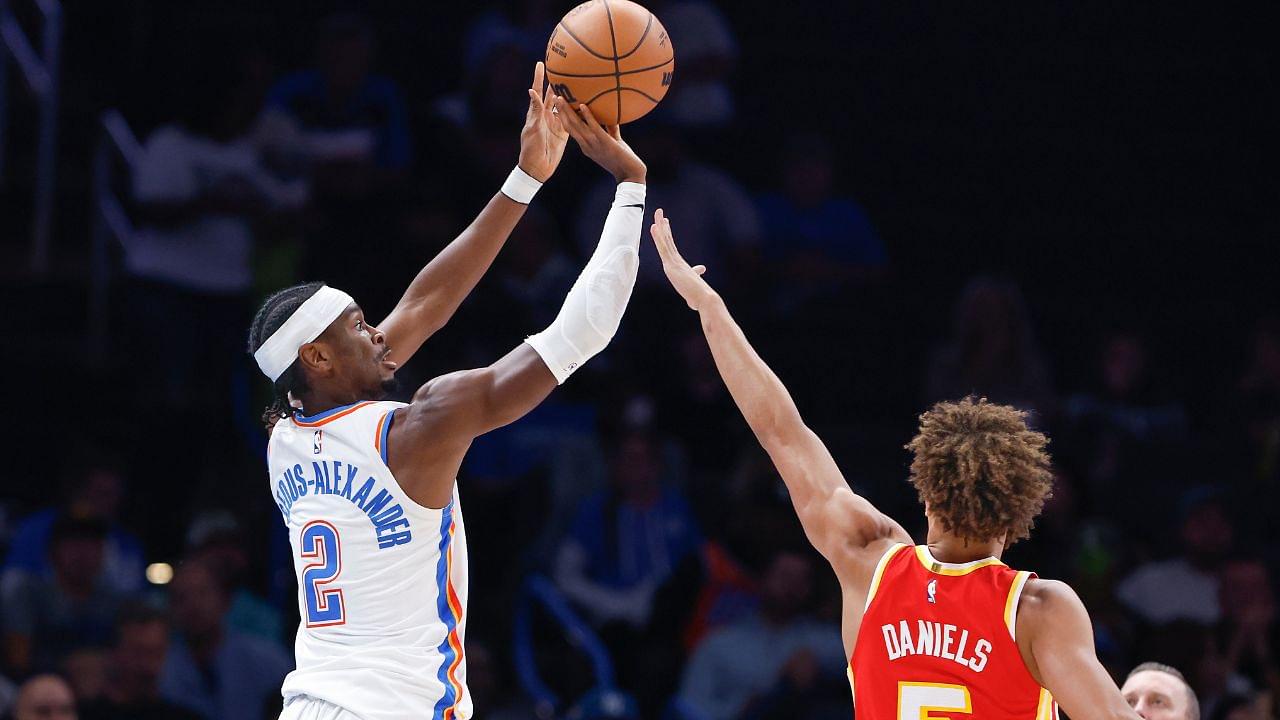 Oklahoma City Thunder guard Shai Gilgeous-Alexander (2) shoots a three point basket as Atlanta Hawks guard Dyson Daniels (5) defends during the second quarter at Paycom Center.