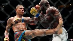 Alex Pereira (red gloves) fights Khalil Rountree Jr. (blue gloves) in a light heavyweight title bout during UFC 307 at Delta Center.