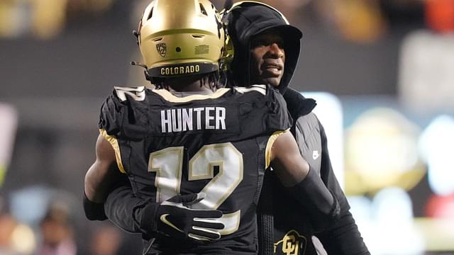 Oct 13, 2023; Boulder, Colorado, USA; Colorado Buffaloes wide receiver Travis Hunter (12) is congratulated for his touchdown by head coach Deion Sanders in the first quarter against the Stanford Cardinal at Folsom Field.