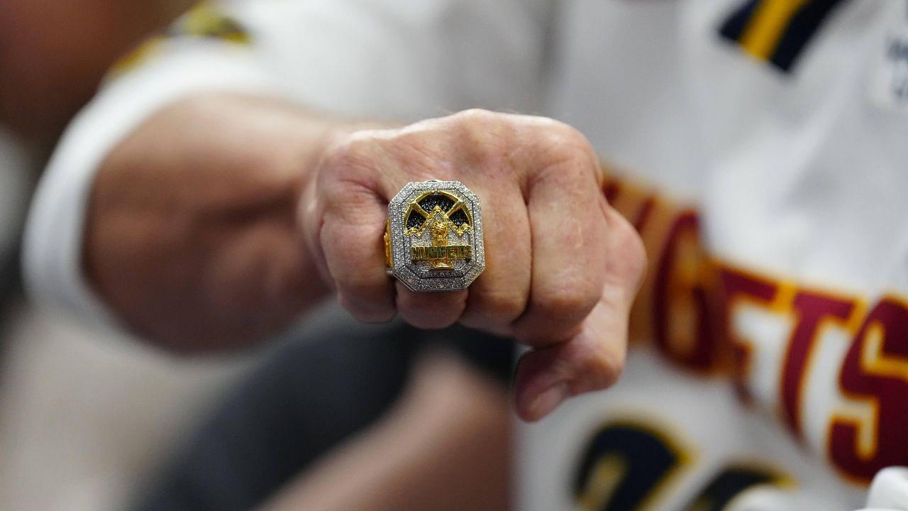 Denver Nuggets fan Gregg Sumey shows off his championship ring during the second half against the Orlando Magic at Ball Arena.