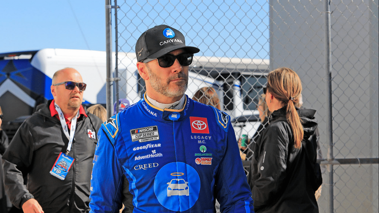 Two-time Daytona 500 Champion Jimmie Johnson walks through the garages to attend the drivers meeting before the Daytona 500, Monday, Feb. 19, 2024 at Daytona International Speedway.