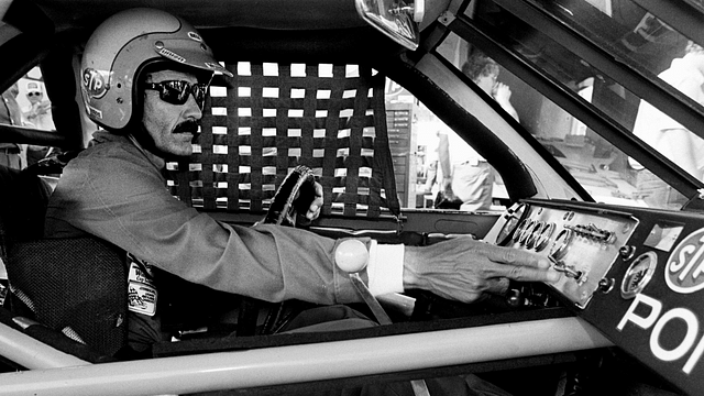 Driver Richard Petty checks the controls during qualifying trials for the Nashville Pepsi 420 NASCAR Grand National race at Nashville International Raceway on July 13, 1984. Petty will start in the third spot for the race.