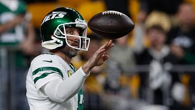 New York Jets quarterback Aaron Rodgers (8) warms up before the game against the Pittsburgh Steelers at Acrisure Stadium.