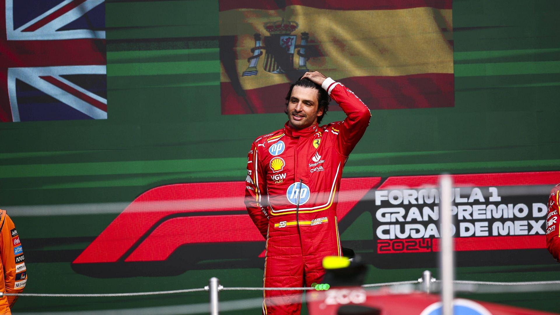 Carlos Sainz (Ferrari) celebrating on the podium after his Mexico City GP win