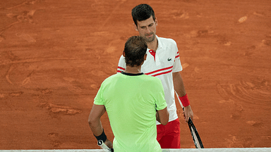 Novak Djokovic (SRB) at the net with Rafael Nadal (ESP) after their match on day 13 of the French Open at Stade Roland Garros.