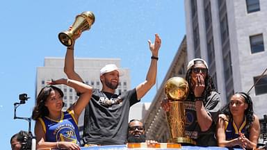 Golden State Warriors guard Stephen Curry (middle left) gestures while standing with wife Ayesha (far left) and guard Damion Lee (middle right) and his wife Sydel Curry (far right) during the Golden State Warriors championship parade in downtown San Francisco.