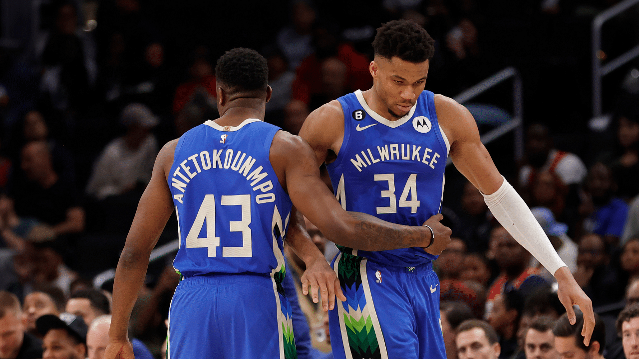 Milwaukee Bucks forward Giannis Antetokounmpo (34) hugs his brother, Bucks forward Thanasis Antetokounmpo (43), while walking off the floor against the Washington Wizards