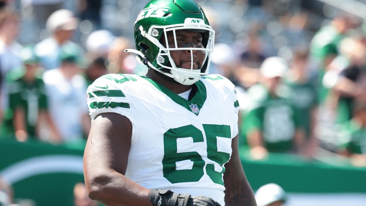 Aug 10, 2024; East Rutherford, New Jersey, USA; New York Jets guard Xavier Newman (65) looks on before the game against the Washington Commanders at MetLife Stadium.